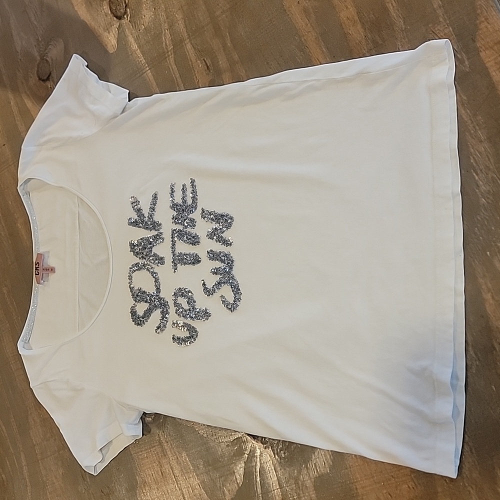 medium CKS WHITE TSHIRT with silver sequence raised words.